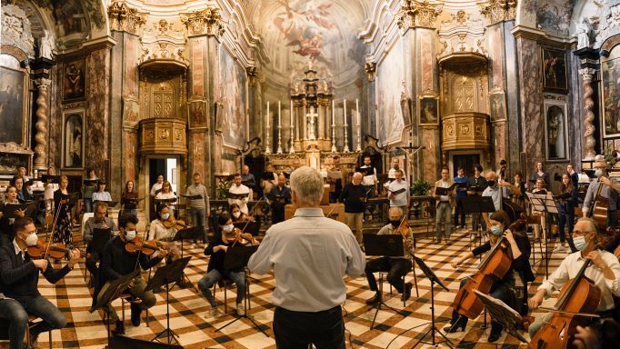 What does the conductor of an orchestra do?
